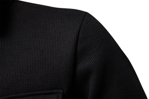 Macro shot of men's waffle jacket showing shoulder stitching and textured fabric details