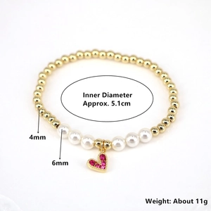 Beaded bracelet with gold beads, white pearls, and red heart zircon charm pendant