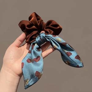 Elegant velvet scrunchie with a blue floral silk ribbon, chic hair accessory for women