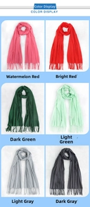Detailed color display of soft solid pashmina scarves with elegant fringe tassels