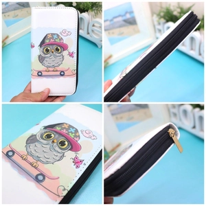 Detail view of cartoon owl long wallet showing zip hardware and white PU leather texture
