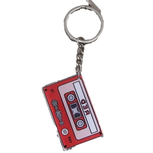 Retro red cassette tape metal keychain featuring BED 13 graphics and Spotify code