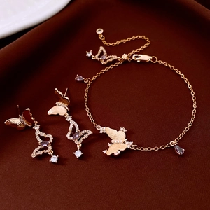 Exquisite gold butterfly jewelry set featuring sparkling purple crystals and clear zircons