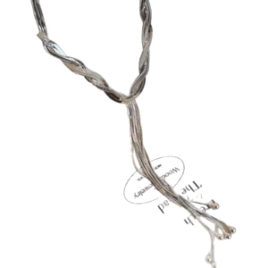 Multilayered silver snake chain necklace with elegant fringe and metallic bead accents