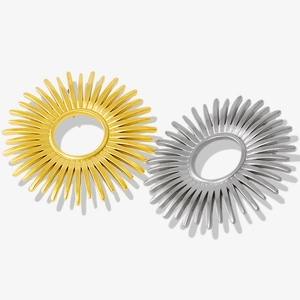Detailed view of sunburst textured stainless steel studs in gold and silver finish