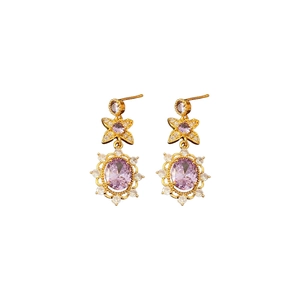 Vintage gold earrings with purple gemstone flower design and oval center stones