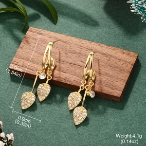 Detailed view of gold leaf drop earrings with white rhinestones and size measurements