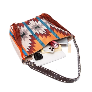 Bohemian woven shoulder bag interior view with tassels showing storage for essentials