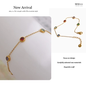 Detailed view of a gold titanium steel necklace with five colorful round zircon gemstones
