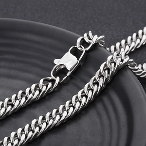 Close-up of a silver stainless steel curb chain with a durable lobster clasp closure