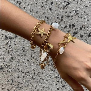 Gold titanium steel ocean charm bracelet set with starfish and shell pendants