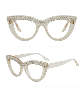 Detail view of tea brown cat eye glasses frames with shimmering rhinestone embellishments