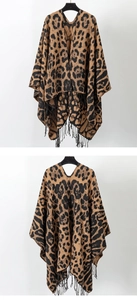 Detail view of vintage leopard print knit shawl with fringe hem and elegant V-neckline