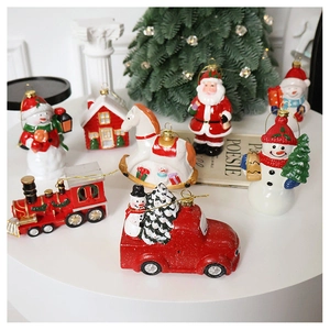 Detailed view of assorted Christmas ornaments including Santa, snowman, and red train