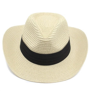 Close-up of the woven texture on a beige Panama straw hat with a black fabric ribbon band