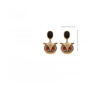 Detailed view of vintage owl earrings with red gem eyes and size specs: 6cm by 3.7cm