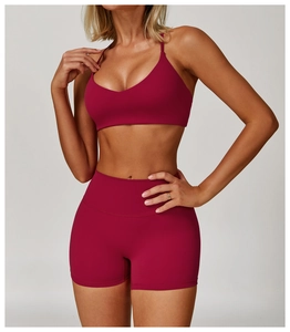 Side view of brushed yoga bra and high waist shorts set in dark burgundy color