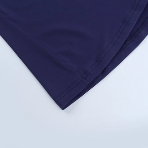 Detail of navy blue dress showing high-quality stitching and smooth fabric texture