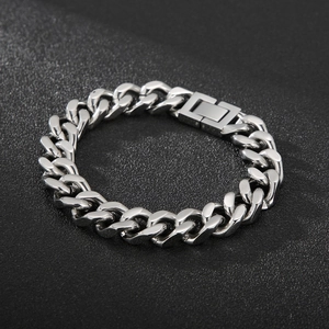 Detailed view of polished stainless steel Cuban chain bracelet with fold-over clasp