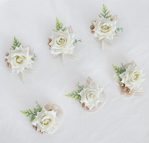 Detailed set of 6 cream rose boutonnieres with gold leaves and ribbon for weddings