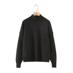 Women's black mock neck knit sweater with drop shoulder and ribbed cuffs on wooden hanger