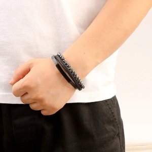 Three-piece set of woven leather bracelets and black beads with stainless steel elements