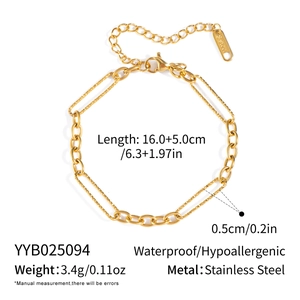 Detail of gold geometric chain link bracelet with lobster clasp and S.Steel tag engraving