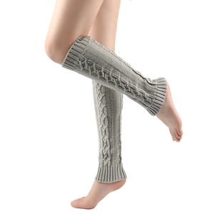 Gray cable-knit leg warmers for women made of soft chunky yarn in a slouchy style