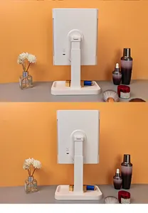 Detail of adjustable LED makeup mirror with white storage base and USB charging port
