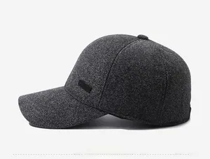 Detail view of dark grey baseball cap with SPORT label and textured warm fabric
