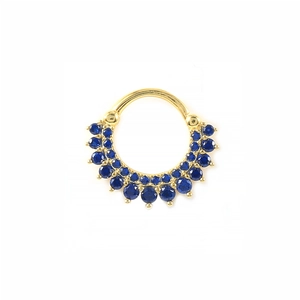 Macro shot of gold septum ring featuring double rows of deep blue cubic zirconia stones