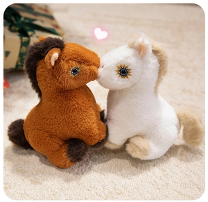 Detail of plush horse toys featuring soft fur texture and cute embroidered eyes