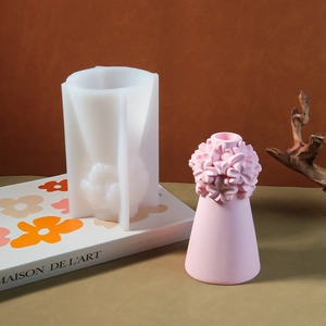 DIY silicone mold for flower candle holder and finished resin piece with floral relief