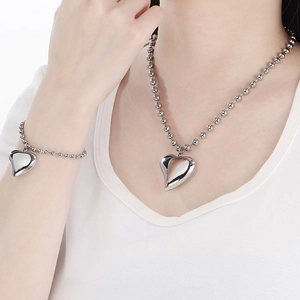 Polished silver heart pendant on beaded chain necklace and bracelet jewelry set