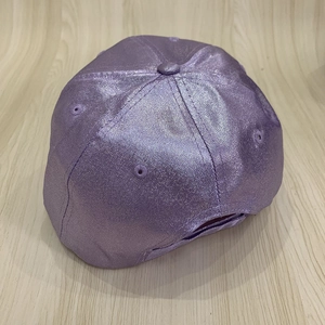 Detailed top view of purple metallic baseball cap with adjustable strap and textured finish