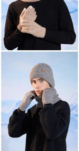 Winter knit set detail featuring touchscreen gloves and cozy neck warmer on snow background