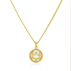 Close-up of golden Gemini zodiac necklace with shell inlay and cable chain details