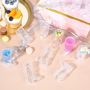 Clear plastic cowboy boot shot glasses for Western theme party and celebratory drinks