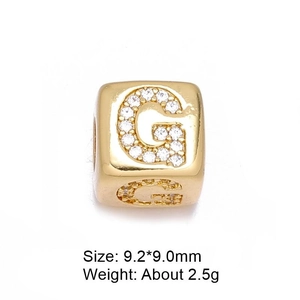 Detailed view of gold G-letter charm bead with cubic zirconia and size dimensions