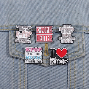 K-Pop enamel pin badges with creative music quotes on denim jacket accessory