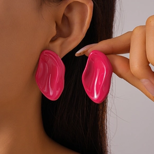Close-up of a model wearing pink irregular oval drip oil geometric stud earrings