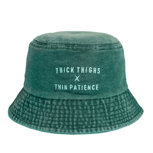 Washed green cotton bucket hat with Thick Thighs Thin Patience white embroidery
