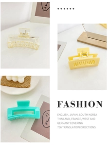Macro detail of rectangle hollow hair claws in candy colors and durable metal spring