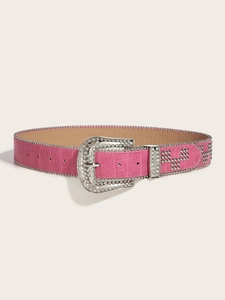 Detailed close-up of pink crocodile leather belt with rhinestone buckle and silver studs
