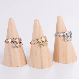Elegant fan-shaped shell rings with pave crystals in rose gold, gold, and silver finishes