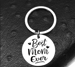 Detailed close-up of Best Mom Ever engraving on a stainless steel round keychain