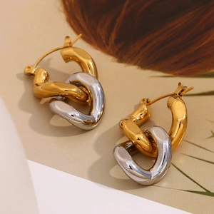 Detailed view of two-tone intertwined chain link earrings in 18K gold and silver finish