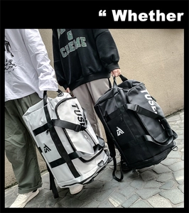 Detail of multi-functional oxford fabric travel bags in black and white with TUSE logo