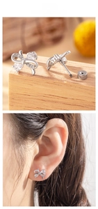 Macro shot of silver bow stud earrings with sparkling pavé stones and screw back closure