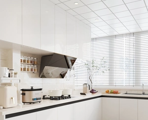 Modern white kitchen scene showing oil-proof non-slip mats with minimalist cabinetry